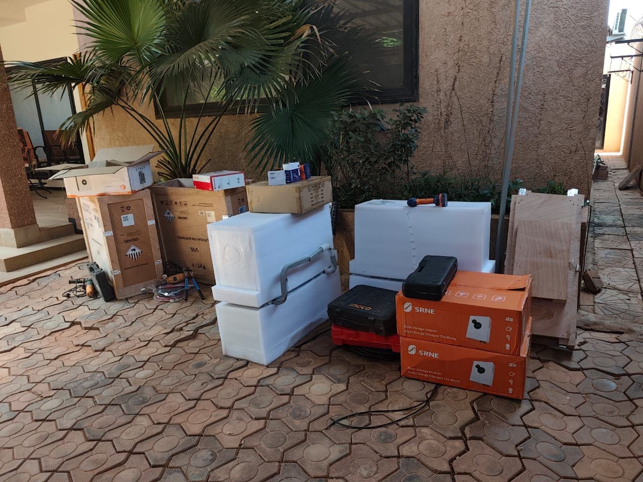 Delivery of solar panels, inverters, and Pytes V15 battery for residential installation in Burkina Faso.